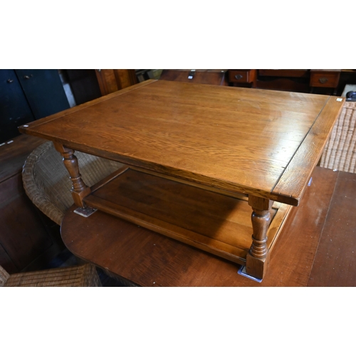 476 - An Ipswich quality large golden oak coffee table, rectangular top on turned supports with open under... 