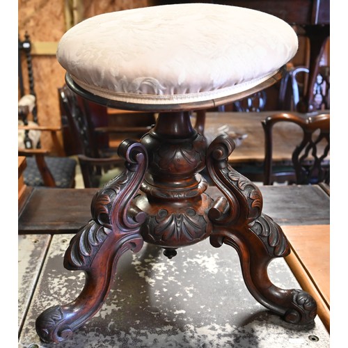 527 - A Victorian carved rosewood piano stool with champagne damask covered revolving seat a/f