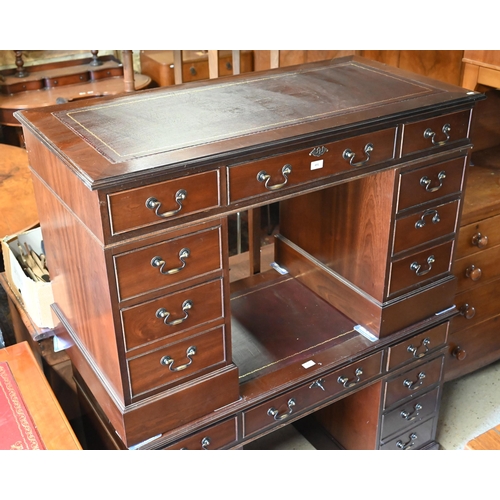 488 - A reproduction mahogany twin pedestal desk with gilt tooled brown leather top over nine drawers (wit... 