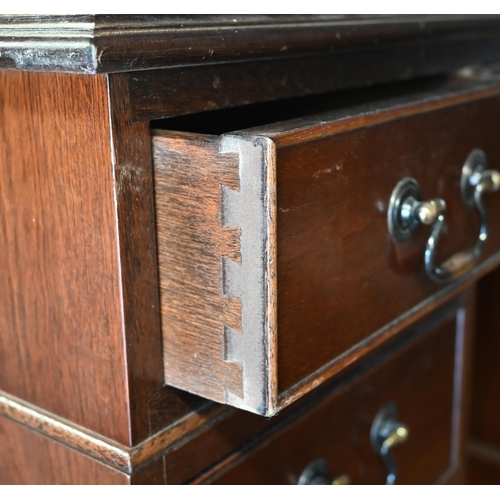 488 - A reproduction mahogany twin pedestal desk with gilt tooled brown leather top over nine drawers (wit... 