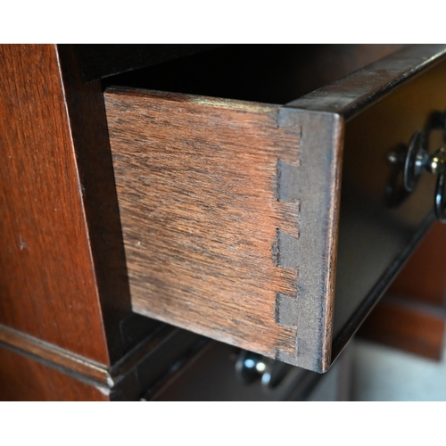 489 - A reproduction mahogany twin pedestal desk with gilt tooled brown leather top over nine drawers (wit... 