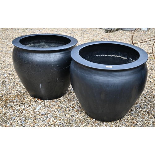 13 - A large black surface finished terracotta planter 70 cm dia. x 73 cm h to/with a smaller pair 57 cm ... 