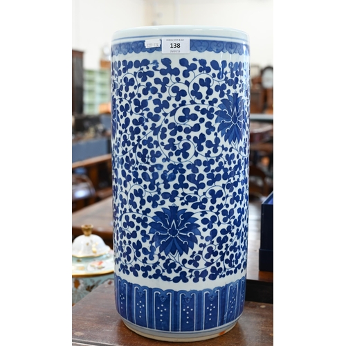 138 - A Chinese blue and white ceramic cylindrical stick-stand with floral and foliate decoration, 46 cm h... 