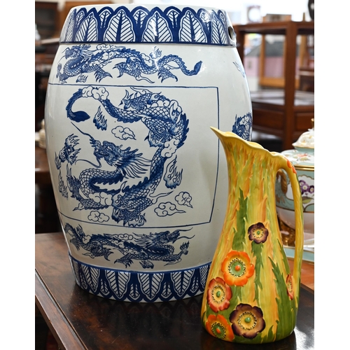 139 - Asian blue and white ceramic barrel-shaped garden seat printed with dragons, 46 cm high to/w a Carlt... 