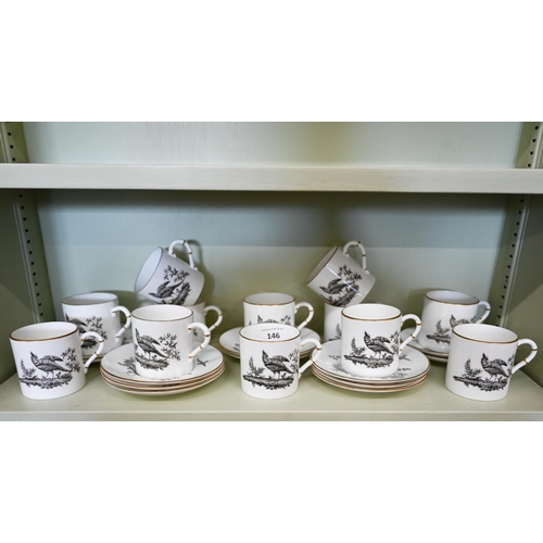 146 - A Royal Worcester set of twelve coffee cans and saucers, monochrome-printed with birds