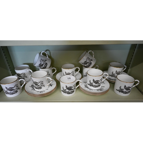 146 - A Royal Worcester set of twelve coffee cans and saucers, monochrome-printed with birds