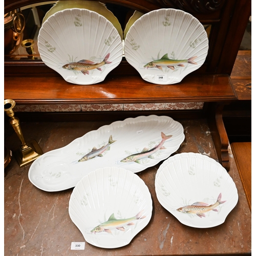 148 - A set of six Limoges shell-dishes printed with fish, to/w a matching long serving dish