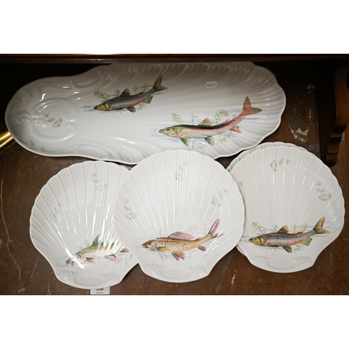 148 - A set of six Limoges shell-dishes printed with fish, to/w a matching long serving dish