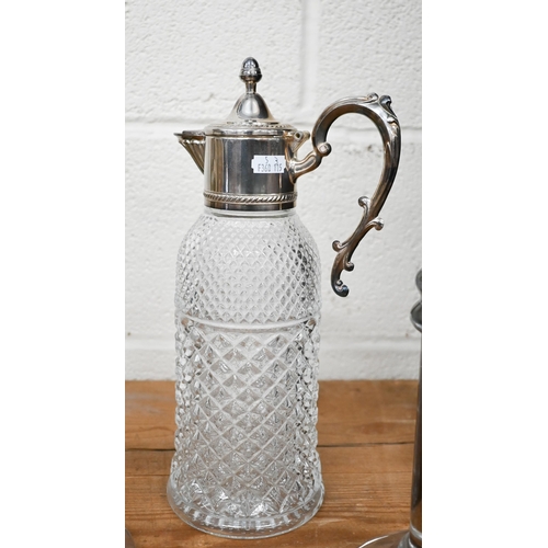 151 - A pressed glass claret jug with ep mounts to/w two Art Deco moulded glass display pillars (3)