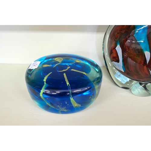 152 - A Mdina coloured glass paperweight bottle/vase, to/w a similar roundel weight (2)