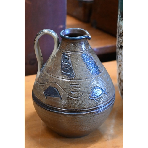 153 - A studio stoneware jug with incised decoration, 17 cm to/w a German earthenware large vase with mott... 