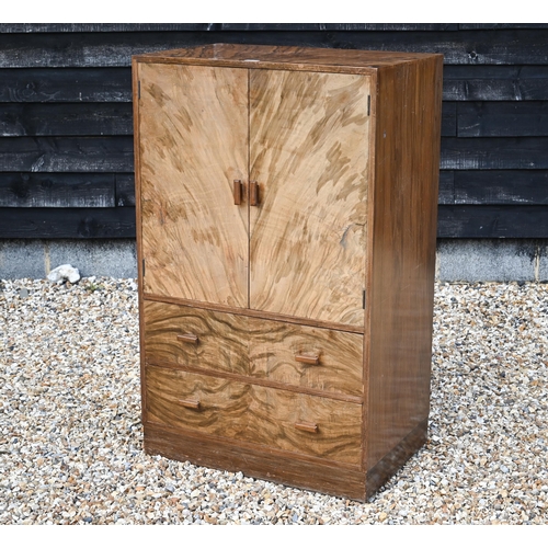 159 - An Art Deco period walnut press cupboard over two graduated drawers, on a plinth base, 75 cm x 50 cm... 