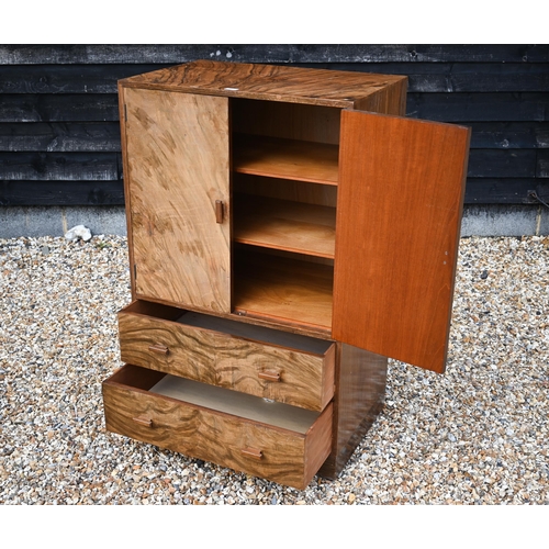 159 - An Art Deco period walnut press cupboard over two graduated drawers, on a plinth base, 75 cm x 50 cm... 