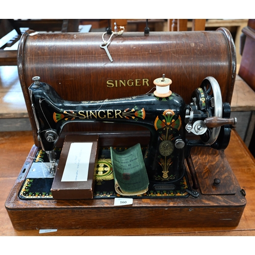 160 - An antique Singer Sewing maching, decorated with Egyptian style decoration, no F9638968, to/w a box ... 