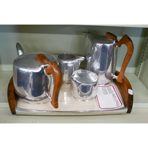 191 - A Piquot ware aluminium four-piece tea service on tray, to/w an EPNS three-piece tea service