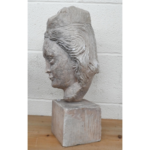 207 - A cast stone female head, 45 cm high