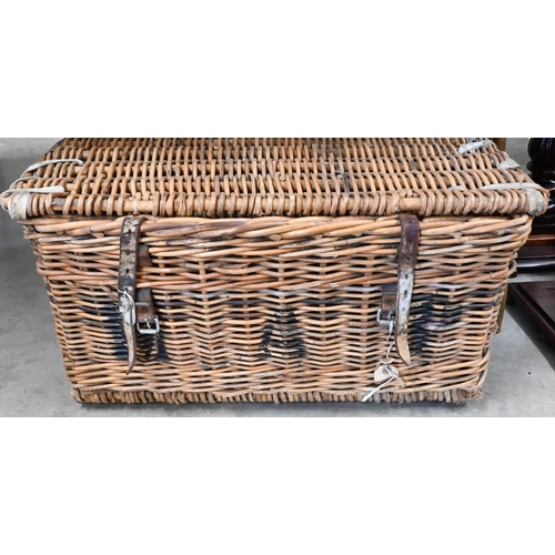 212 - A large  wicker laundry hamper containing a quantity of copper and brassware