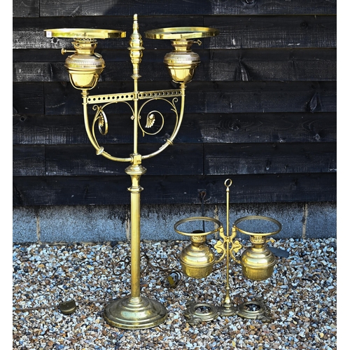 220 - A large brass oil standard lamp with two lamps, converted to electricity, 28 cm high to/w an adjusta... 