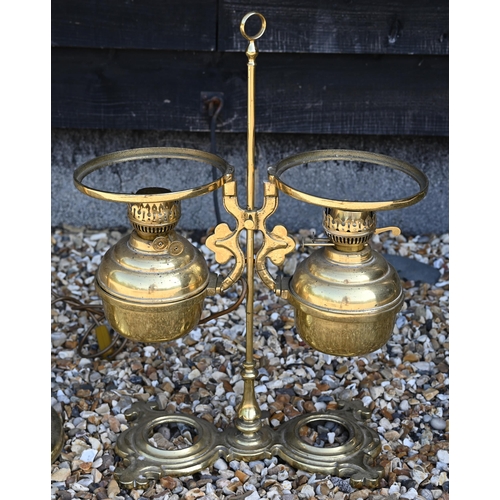 220 - A large brass oil standard lamp with two lamps, converted to electricity, 28 cm high to/w an adjusta... 