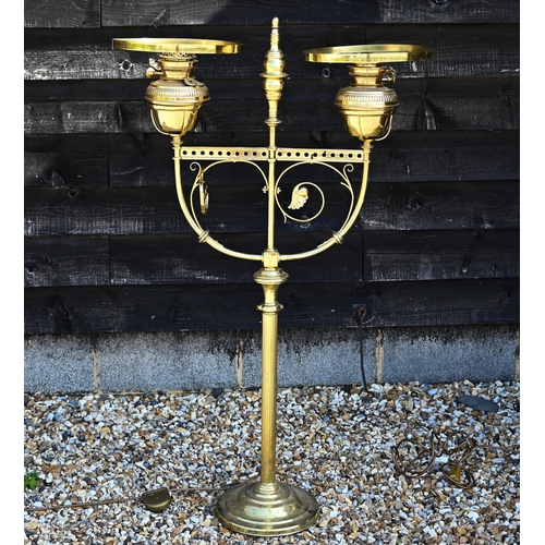 220 - A large brass oil standard lamp with two lamps, converted to electricity, 28 cm high to/w an adjusta... 