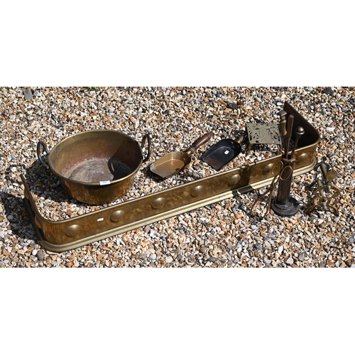 228 - A brass hearth fender to/w two coal shovels, fire irons and a preserving pan