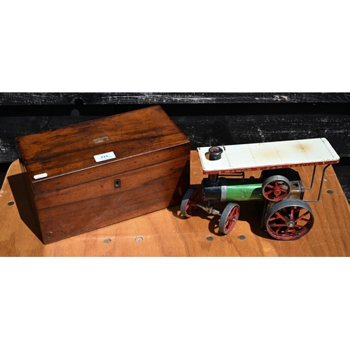 233 - A 19th century mahogany tea caddy, 29 cm wide, to/w a Mamod steam tractor (2)