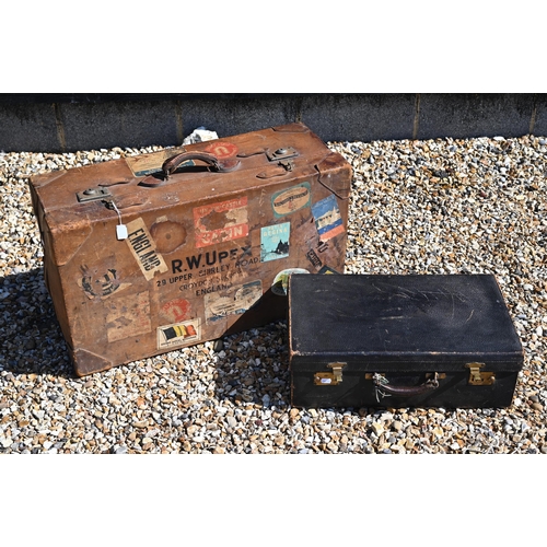 236 - A large vintage leather suitcase with various labels including Cunard White Star First Class and var... 