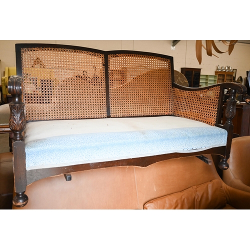 249 - An oak framed bergere two seater sofa with caned decoration, 140 cm wide x 80 cm deep x 80 cm high