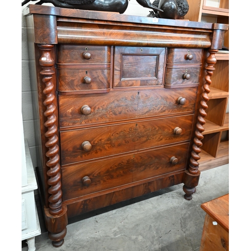 A large Victorian mahogany chest with cavetto drawer over an arrangement of seven other drawers between barleytwist pillars, 125 cm wide x 60 cm deep x 126 cm high