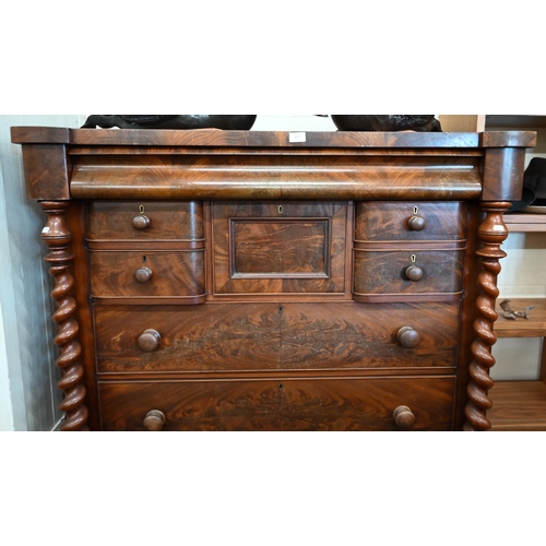 317 - A large Victorian mahogany chest with cavetto drawer over an arrangement of seven other drawers betw... 