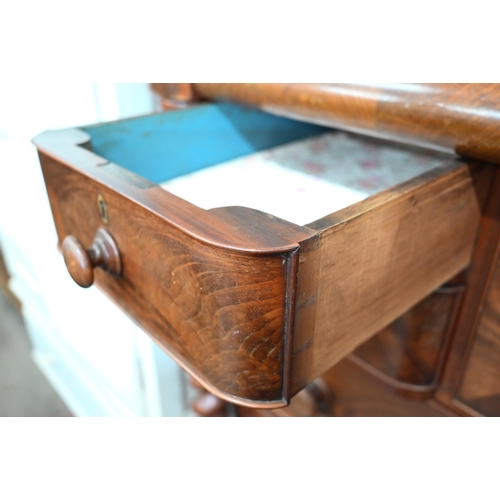 317 - A large Victorian mahogany chest with cavetto drawer over an arrangement of seven other drawers betw... 