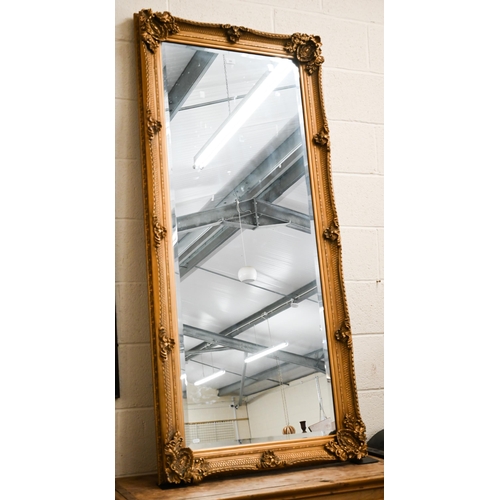 326 - A large Baroque style gilt framed wall mirror with bevelled plate