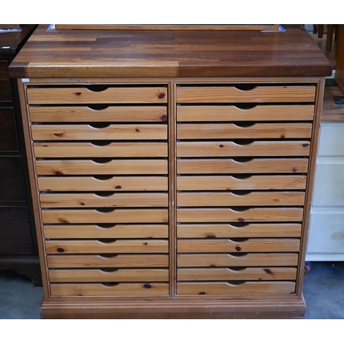 338 - A beech and pine twenty-six drawer plan chest, 102 x 70 x 102 cm