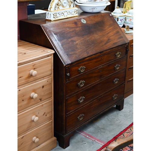 349 - A George III mahogany bureau with four graduating drawers, standing on bracket feet a/f, 100 x 53 x ... 