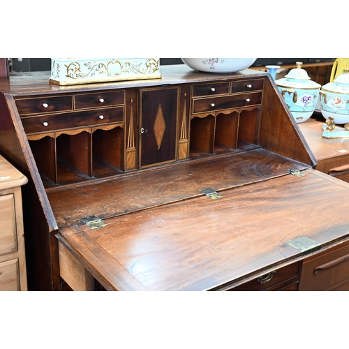 349 - A George III mahogany bureau with four graduating drawers, standing on bracket feet a/f, 100 x 53 x ... 