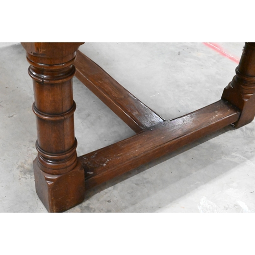 352 - A good quality oak refectory style dining table with cleated five-plank top raised on turned legs un... 