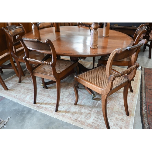 355 - Six Regency mahogany rope back dining chairs with caned seats to/w an oval dining table with a quadr... 