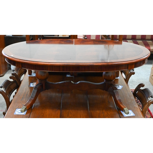 356 - # Reproduction flame mahogany crossbanded oval coffee table