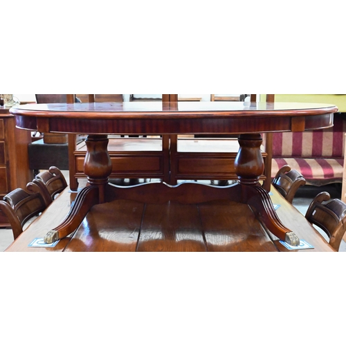 356 - # Reproduction flame mahogany crossbanded oval coffee table