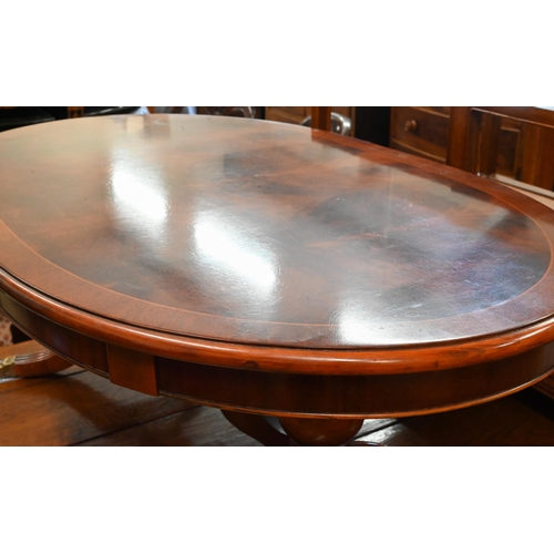 356 - # Reproduction flame mahogany crossbanded oval coffee table