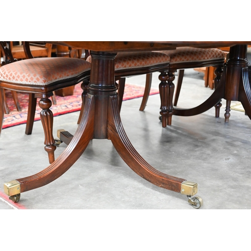 358 - A Regency style mahogany extending dining table with single central leaf on twin pedestal supports, ... 