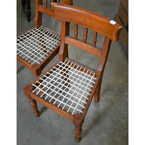 367 - A pair of South African hardwood spindle back 'riempie' childrens chairs with interlaced leather sea... 