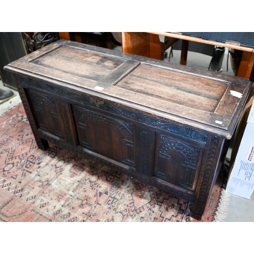 369 - A carved oak panelled coffer 118 x 44 x 60 cmh to/w a trunk (2)