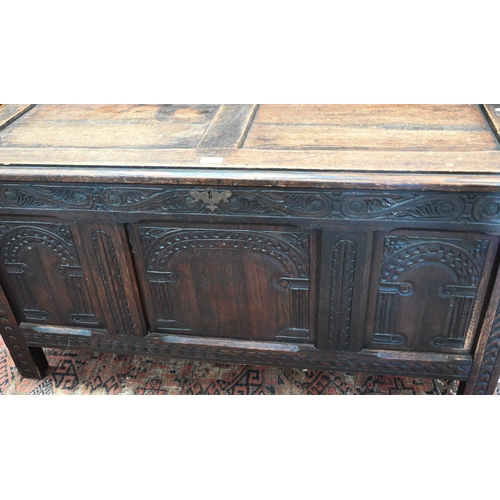 369 - A carved oak panelled coffer 118 x 44 x 60 cmh to/w a trunk (2)