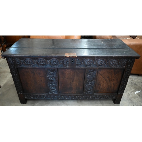 373 - An antique carved oak panelled coffer, 136 x 55 x 70 cm h