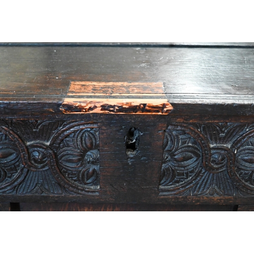 373 - An antique carved oak panelled coffer, 136 x 55 x 70 cm h