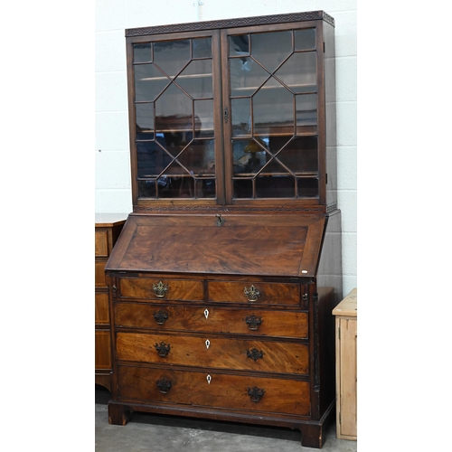 374 - A Georgian mahogany bureau with two short over three long drawers, with associated glazed bookcase t... 