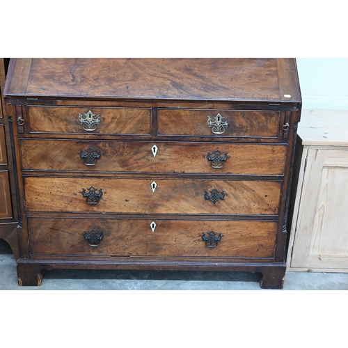 374 - A Georgian mahogany bureau with two short over three long drawers, with associated glazed bookcase t... 