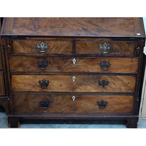 374 - A Georgian mahogany bureau with two short over three long drawers, with associated glazed bookcase t... 