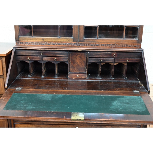 374 - A Georgian mahogany bureau with two short over three long drawers, with associated glazed bookcase t... 